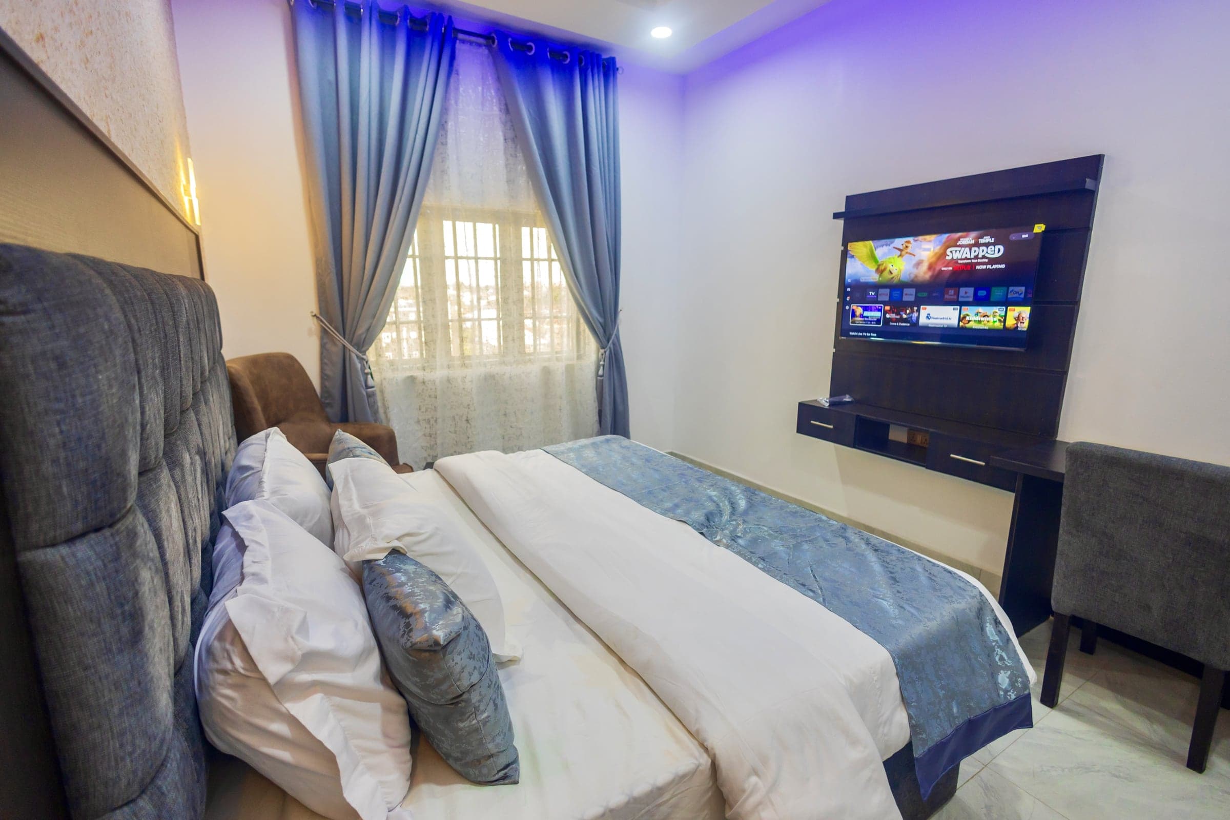 Deluxe Room at Diplomat Enclave Suites with a king bed and more living space