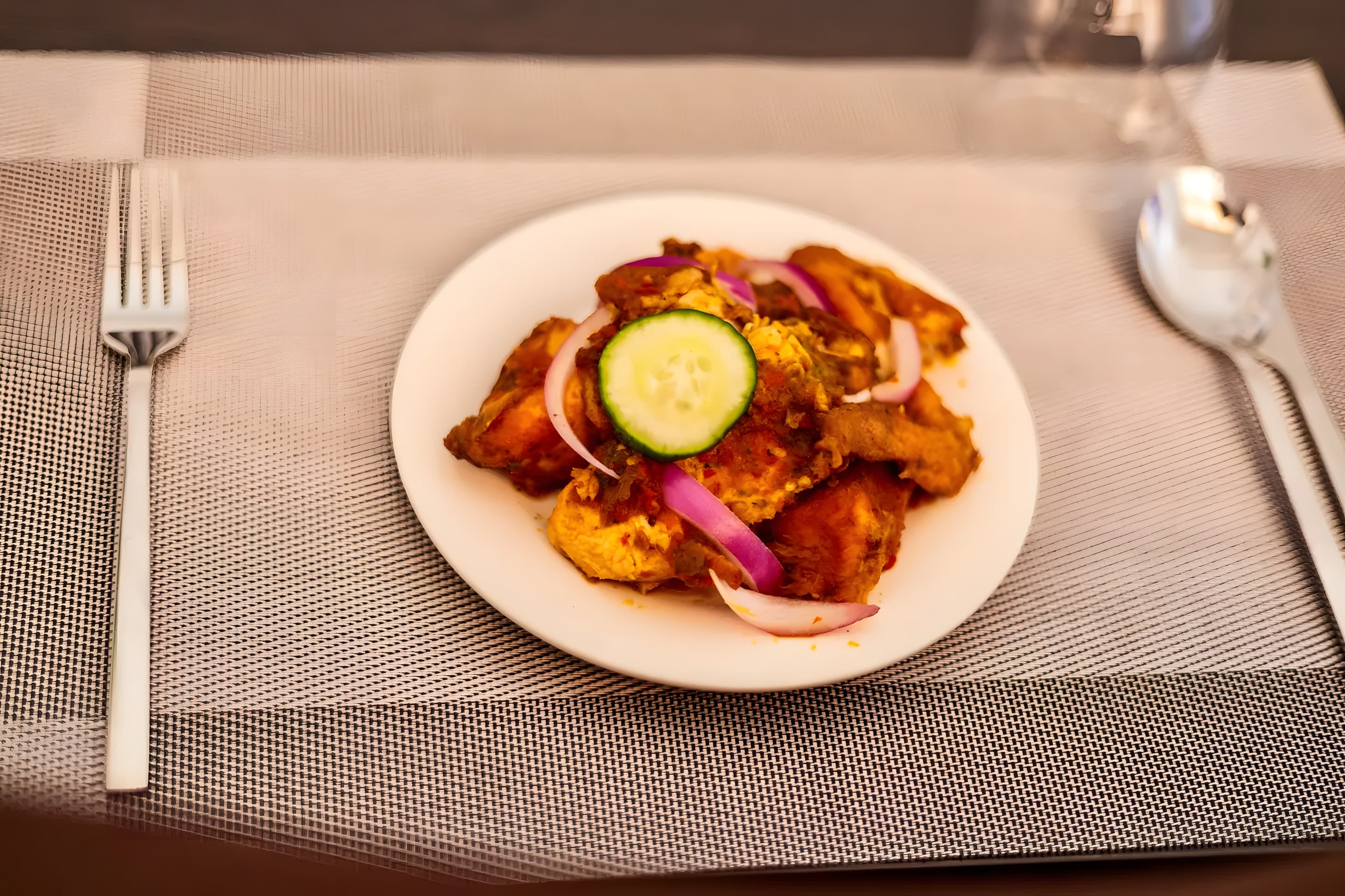 Grilled chicken meal served at Diplomat Enclave Suites restaurant