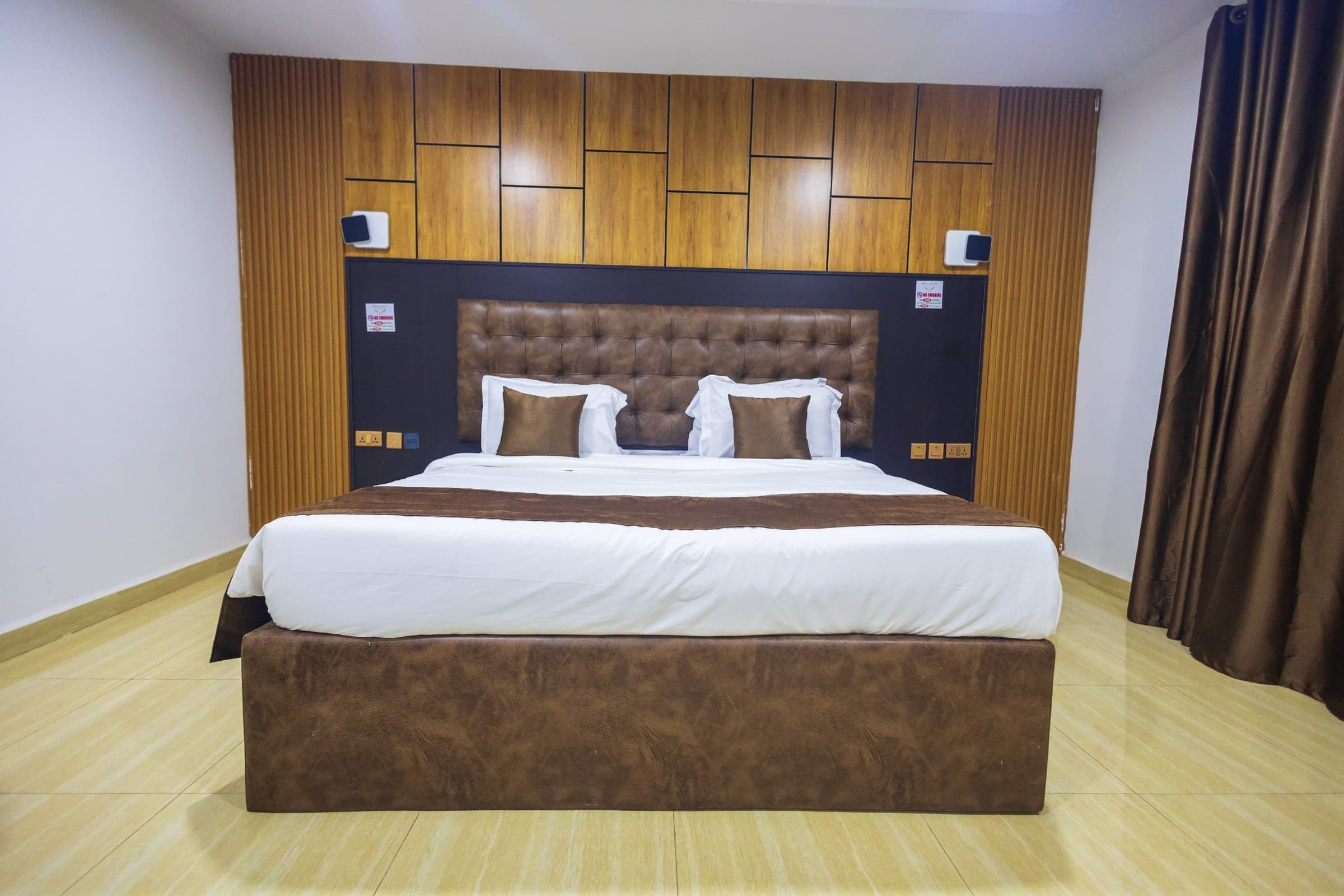 Executive Room at Diplomat Enclave Suites with a king bed and generous living space