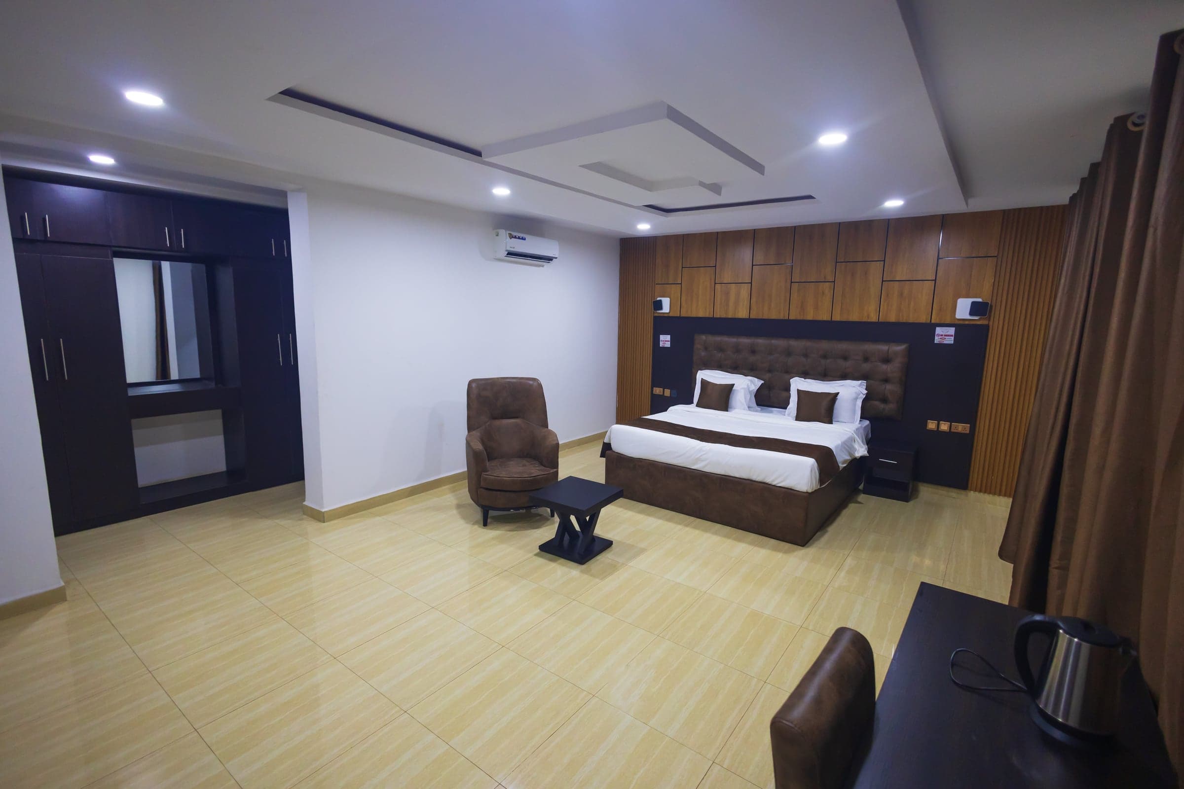 Executive Room at Diplomat Enclave Suites with a king bed and executive workspace