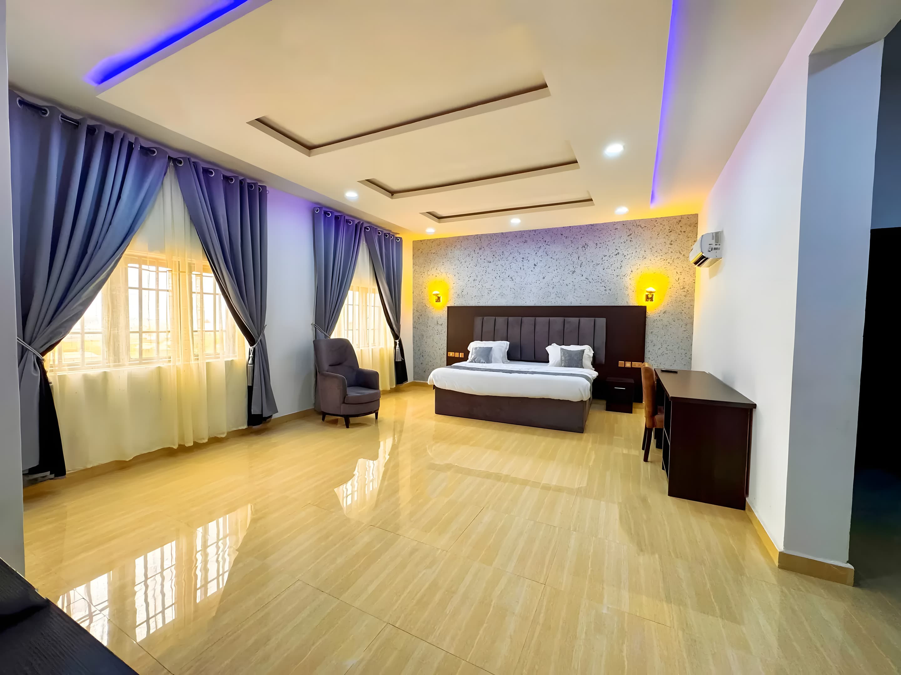A spacious guest room at Diplomat Enclave Suites in Abuja