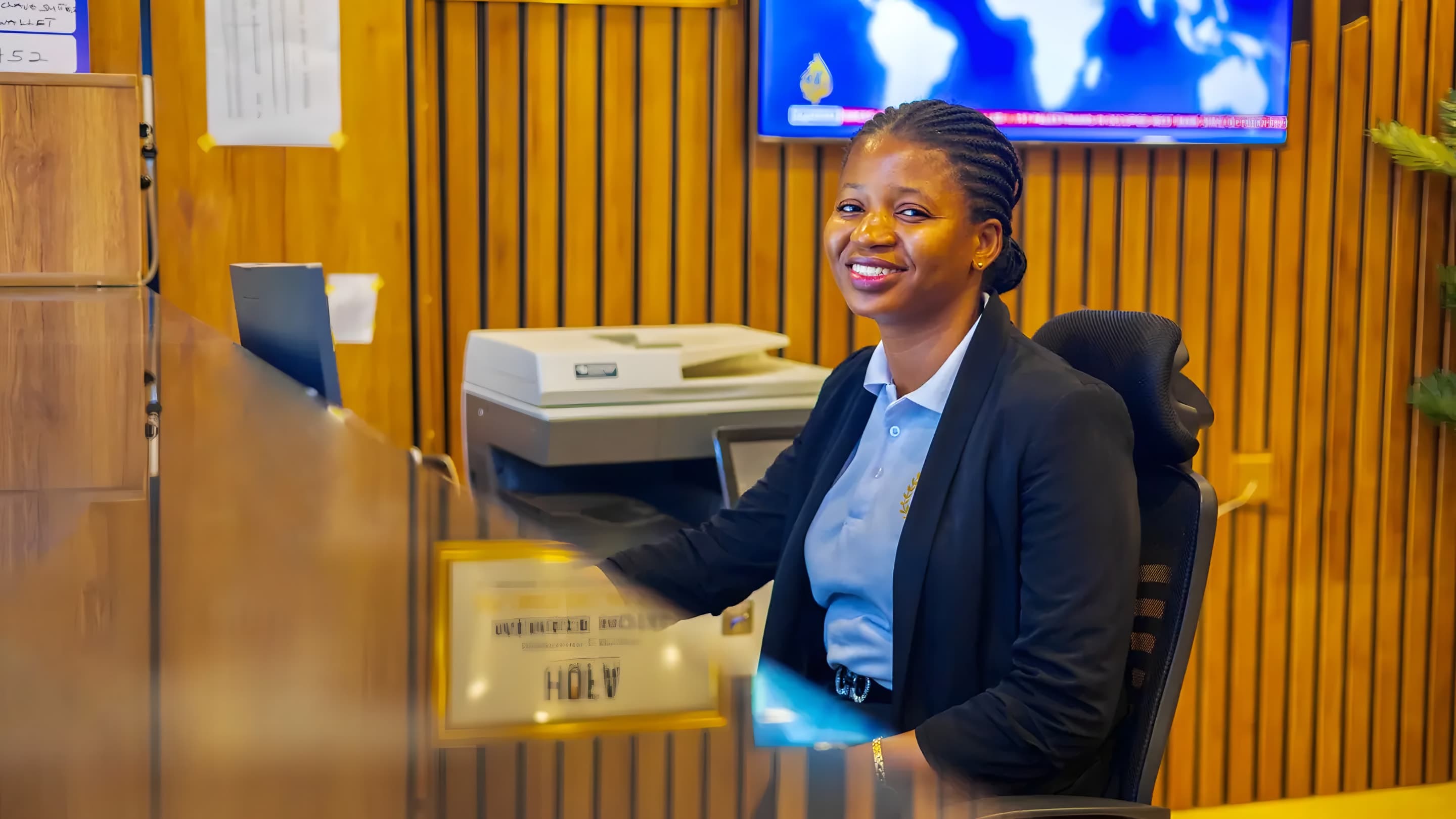 Receptionist welcoming guests at the reception of Diplomat Enclave Suites