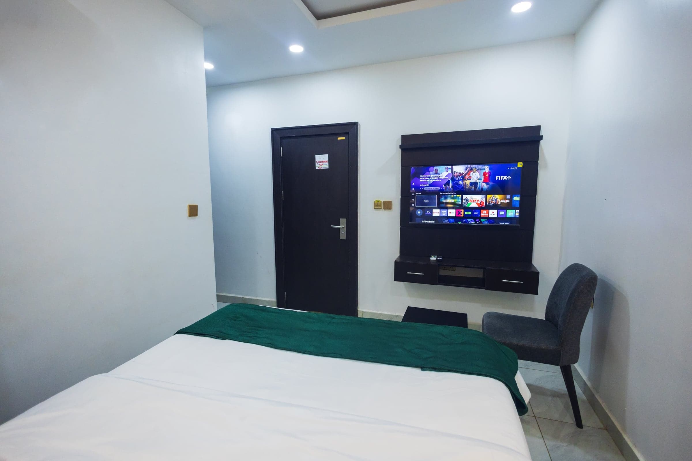 Standard Room at Diplomat Enclave Suites with an ensuite bathroom and neutral palette