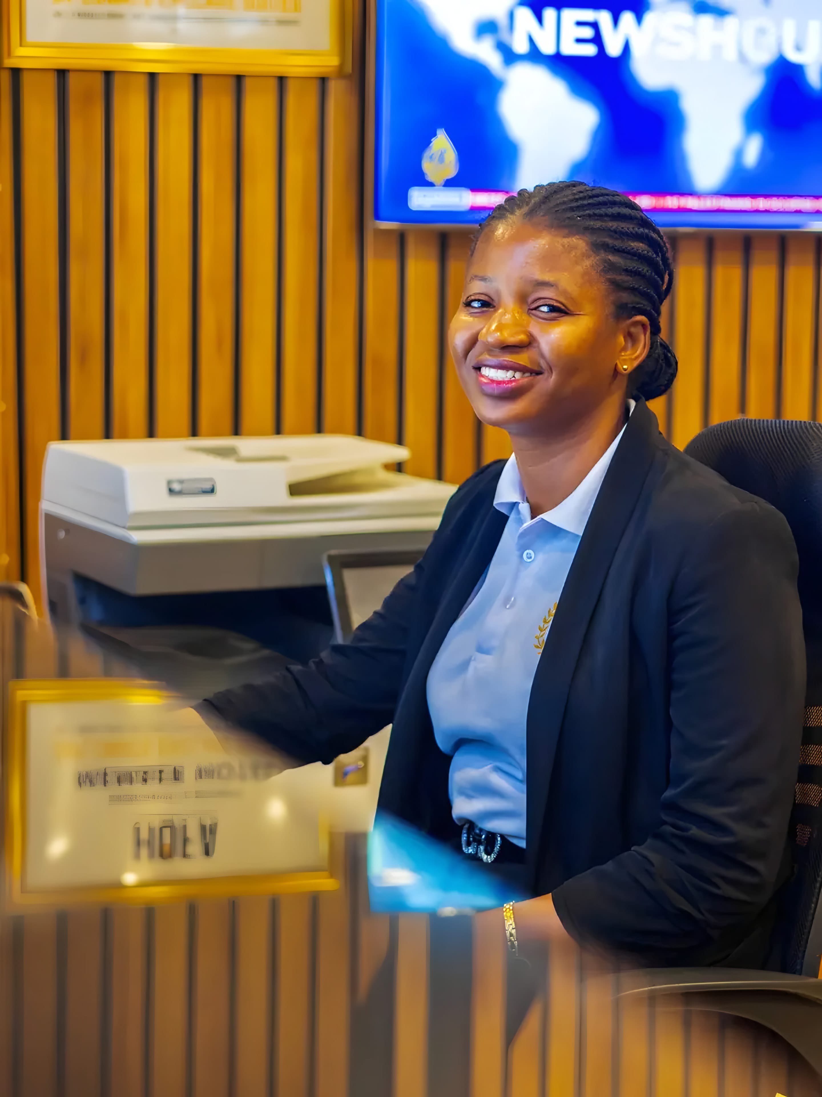 Receptionist welcoming guests at the reception of Diplomat Enclave Suites